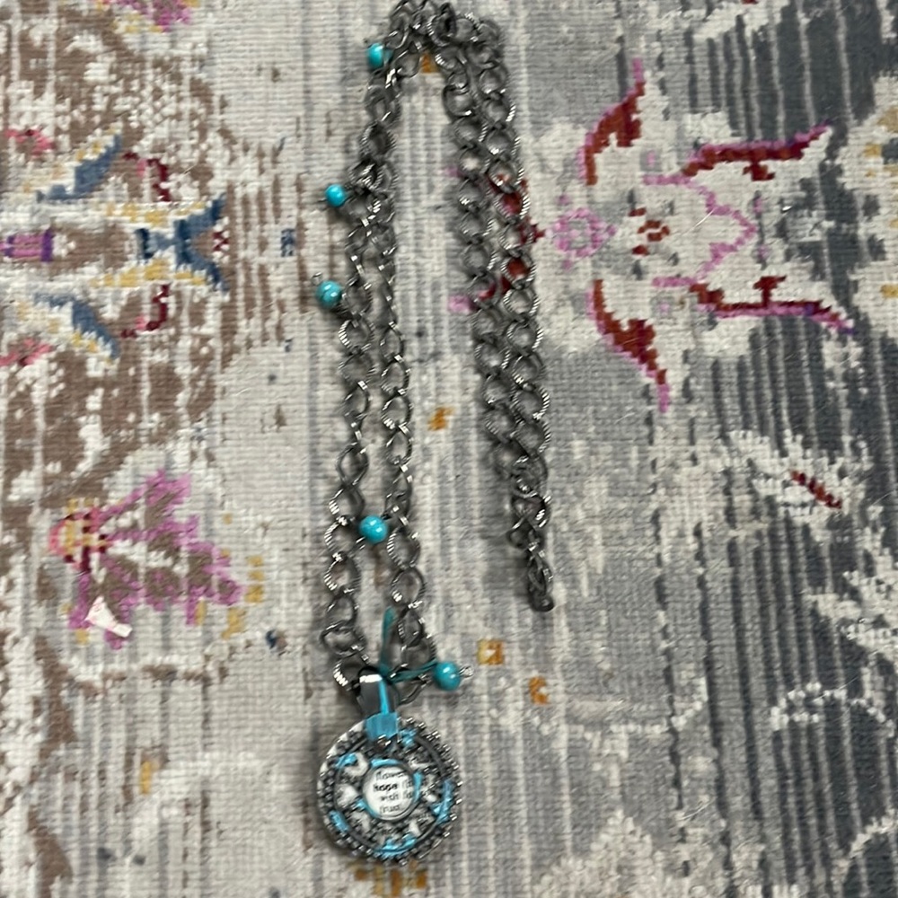 18” silver and turquoise necklace with book print Hope at the center.